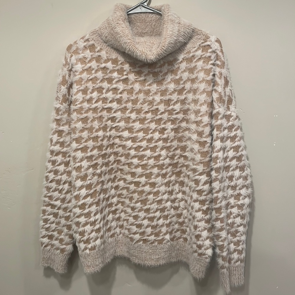 Like new cozy sweater. Bought on the coast of Maine only worn twice
